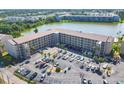 Beautiful aerial view of condo complex showcasing manicured landscaping, private parking, and serene lake views at 3521 Lake Bayshore Dr # 3521, Bradenton, FL 34205