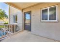 Inviting condo entrance featuring a covered porch, neutral stucco, and well-maintained landscaping for enhanced curb appeal at 3521 Lake Bayshore Dr # 3521, Bradenton, FL 34205