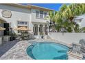 Beautiful backyard pool area with ample seating and lush tropical landscaping at 4108 Roberts Point Rd, Sarasota, FL 34242