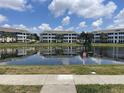 Scenic view of the condo buildings reflected in the serene pond at 4802 51St W St # 1724, Bradenton, FL 34210