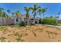 A charming single-story home with a light blue exterior and well-maintained front yard at 513 25Th W Ave, Bradenton, FL 34205