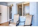 Relaxing balcony with comfortable seating, perfect for enjoying ocean breezes and views at 5300 Gulf Dr # 501, Holmes Beach, FL 34217