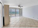 Bright and airy living space with tile flooring and expansive ocean views through large windows at 5300 Gulf Dr # 501, Holmes Beach, FL 34217