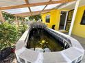 Backyard featuring a unique pond, adding character to the outdoor space at 616 63Rd W Ave, Bradenton, FL 34207