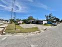 Charming single-story home featuring a spacious driveway and covered parking, perfect for multiple vehicles at 616 63Rd W Ave, Bradenton, FL 34207