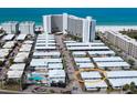 Aerial view of the home with pool and surrounding community near white sand beach and ocean at 6300 Midnight Pass Rd # 5, Sarasota, FL 34242