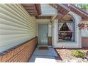 A front door with a welcome mat and brick siding at 6332 7Th E Ct, Bradenton, FL 34203