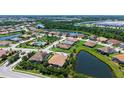 Beautiful aerial view of the neighborhood showing community pool, lakes and beautiful homes at 11603 Bluebird Pl, Lakewood Ranch, FL 34211