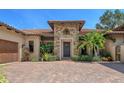 Stunning Mediterranean home featuring a stone facade, tile roof, and meticulously landscaped front yard at 1813 Boyce St, Sarasota, FL 34239