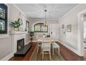 Bright dining room with hardwood floors and a view of the front door at 301 W South Ave, Tampa, FL 33603