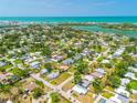 Breathtaking aerial view of the neighborhood with ocean access and nearby attractions at 302 Pavonia Rd, Nokomis, FL 34275