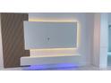 Modern living room with sleek floating shelves, wood accent wall, backlit tv, and stylish recessed lighting at 3386 Irma St, North Port, FL 34291