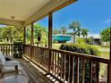 Relaxing porch with outdoor seating, greenery, and neighborhood views, perfect for enjoying quiet moments at 3828 6Th W Ave, Palmetto, FL 34221