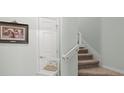 Carpeted stairs lead to the upper level of the house at 4204 Overture Cir # 4204, Bradenton, FL 34209