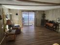 Spacious living room with modern floors, providing a comfortable area for relaxation and entertainment at 5301 Algeria Ct, Bradenton, FL 34207