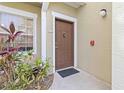 Inviting front door with a modern design, white trim, and a well-maintained exterior at 5401 Bentgrass Dr # 1-113, Sarasota, FL 34235