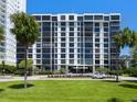 Exterior shot of Essex House featuring lush landscaping and a well-maintained facade at 707 S Gulfstream Ave # 301, Sarasota, FL 34236