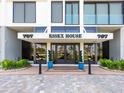 Grand entrance to Essex House with manicured landscaping and elegant architectural details at 707 S Gulfstream Ave # 301, Sarasota, FL 34236