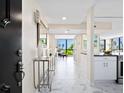 Inviting foyer featuring modern design, marble floors, and an open view to the living area at 707 S Gulfstream Ave # 301, Sarasota, FL 34236