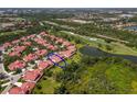 Beautiful community featuring lush landscaping, golf course views, and stunning red tile roofs at 7331 Villa D Este Dr, Sarasota, FL 34238