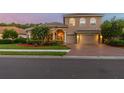 Charming two-story home with a brick driveway, three-car garage, and well-maintained landscaping at 9008 Brookfield Ter, Bradenton, FL 34212