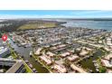 Breathtaking aerial view of a waterfront community, showcasing the extensive canal system and vibrant coastal living at 9822 Desoto Ct, Bradenton, FL 34210