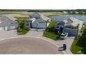 A residential neighborhood is displayed, highlighting the lush landscaping and serene lake views surrounding the homes at 10030 Degas Ter, Bradenton, FL 34212