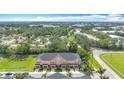 Beautiful aerial shot of townhomes surrounded by lush landscaping in a well-planned community at 1053 Grantham Dr, Sarasota, FL 34234