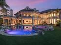 Expansive backyard featuring a modern pool, hot tub, and covered patio with a spiral staircase, perfect for entertaining at 1423 & 1435 Hillview Dr, Sarasota, FL 34239