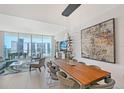 Bright, open-concept living space with floor-to-ceiling windows and elegant furnishings at 301 Quay Commons # 1208, Sarasota, FL 34236