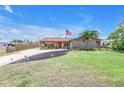 Well-maintained lawn and landscaping highlight this cozy single-story home at 3311 Florida Blvd, Bradenton, FL 34207