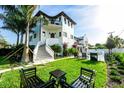 Spacious backyard featuring a private pool, seating area, and lush landscaping at 340 Jackson Dr, Sarasota, FL 34236