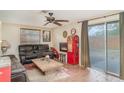 Living room featuring unique decor, a fireplace, and sliding glass doors to the outside at 3921 Marlborough Pl, Sarasota, FL 34241