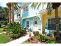 Charming townhouse with a beautifully decorated entryway and well-manicured landscaping at 4727 Sabal Key Dr # 4727, Bradenton, FL 34203