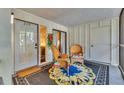 Cozy outdoor patio with comfortable seating, perfect for relaxing at 6501 Mourning Dove Dr # 215, Bradenton, FL 34210