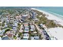 Stunning aerial view of a coastal community with beach access at 135 Avenida Veneccia, Sarasota, FL 34242