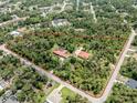 Aerial view of property with home and outbuilding highlighted by property boundaries at 1401 Pelican Ln, North Port, FL 34286