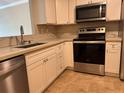 Bright kitchen featuring stainless steel appliances and modern countertops at 2650 Coconut Bay Ln # 521, Sarasota, FL 34237
