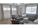 Bright living room with lots of natural light, featuring a comfortable seating area and neutral decor at 3730 Ferguson St, Sarasota, FL 34233