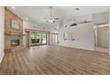 Spacious living room features a brick fireplace, high ceilings, and sliding doors to the patio at 4622 34Th E Ct, Bradenton, FL 34203