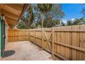 Home's backyard featuring a wooden fence and brick-paved patio at 500 N Jefferson Ave # G5, Sarasota, FL 34237