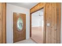 Inviting foyer features tile flooring, wood accents, and a glimpse into the spacious, light-filled living area at 5639 Blount Ave, Sarasota, FL 34231
