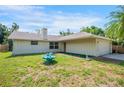 Quaint single-story home features a well-maintained lawn, front yard fountain and attached two-car garage at 5639 Blount Ave, Sarasota, FL 34231