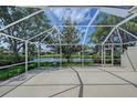 Spacious screened patio overlooking the pond, perfect for outdoor enjoyment at 5787 Ivrea Dr, Sarasota, FL 34238