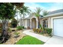Beautiful home with a landscaped front yard, stone accents, and a walkway leading to the front door at 5905 32Nd E St, Ellenton, FL 34222