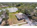 Aerial view of a charming home near a serene lake, showcasing its prime location and natural surroundings at 6572 Mauna Loa Blvd, Sarasota, FL 34241