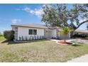 Well-manicured front lawn with decorative landscaping and a charming single-story home at 6572 Mauna Loa Blvd, Sarasota, FL 34241
