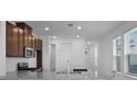 Modern kitchen featuring granite countertops, stainless steel appliances, and ample cabinet space at 8632 Snowfall St, Sarasota, FL 34241