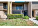 Two story townhouse with a private balcony and lush landscaping at 935 Sunridge Way # B4, Sarasota, FL 34234