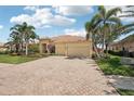 Attractive single-story home with a tile roof and a paved driveway at 1251 Tuscany Blvd, Venice, FL 34292